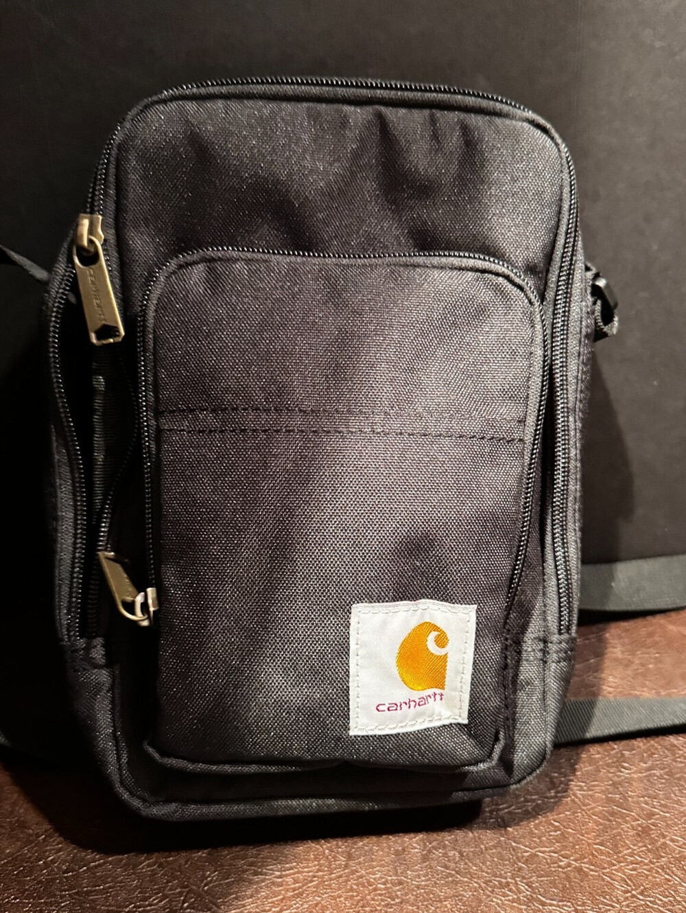 Carhartt Crossbody Zip Bag, Durable with Zipper, Black with Bonus Flashlight